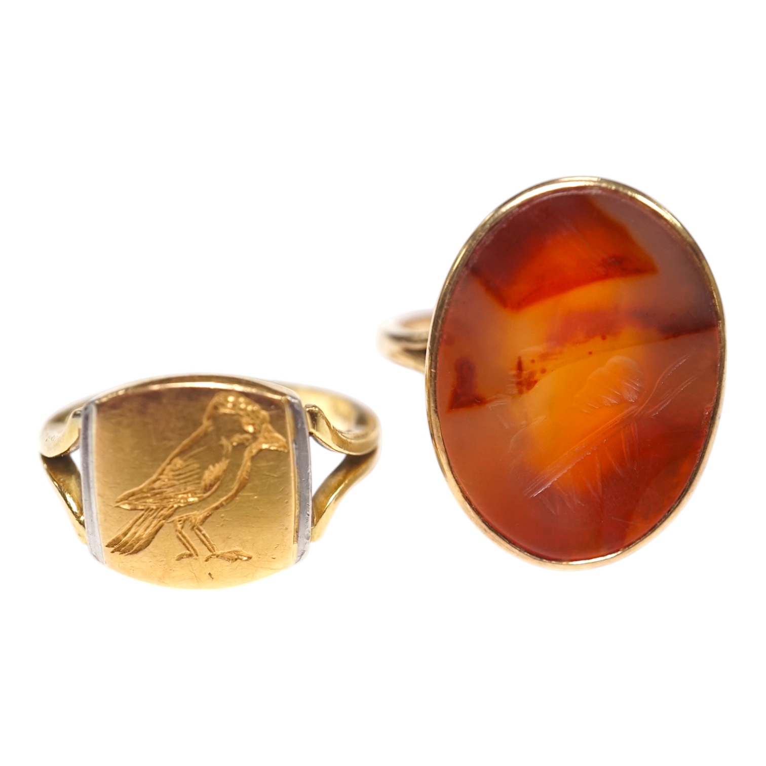 A yellow metal and intaglio agate set oval ring, size P, together with a modern 18ct gold signet ring, engraved with a bird, gross weight 12.3 grams. Condition - poor to fair